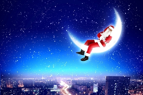 Santa Claus on the moon above a city at night