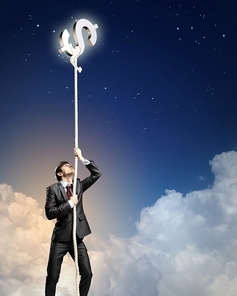 Image of businessman climbing rope attached to dollar sign