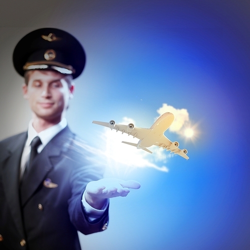 Image of pilot with airplane taking off from his hand