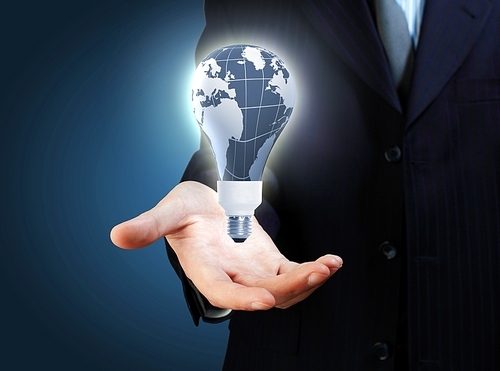 Hand with lamp and hands of a business person