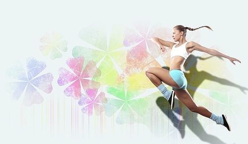 Image of sport girl in jump against flower background