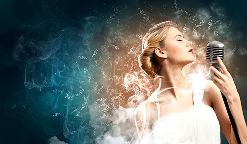 Image of female blonde singer holding microphone against smoke background with closed eyes