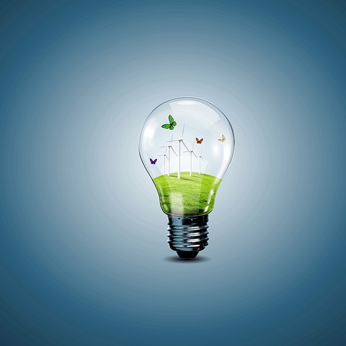 Electric light bulb and a plant inside it as symbol of green energy