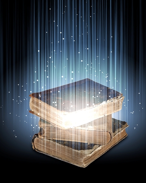 Magic book with light coming from inside it