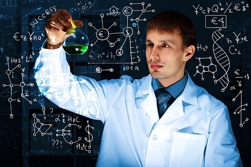 Young scientist in laboratory in white uniform