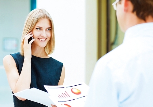 Two young business collegue working together in office