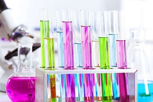 Chemistry laboratory glassware with colour liquids in them