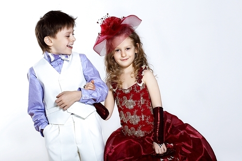 Portrait of a little boy and girl in beautiful dress