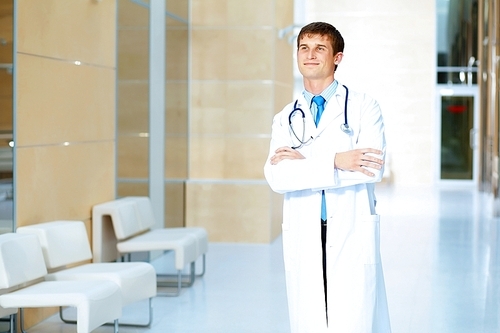 Portrait of friendly male doctor in hospital smiling