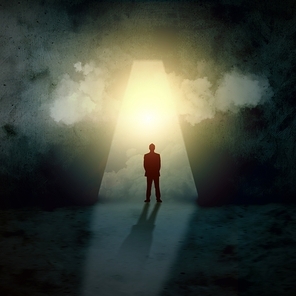 Silhouette of businessman standing in keyhole sun shining above
