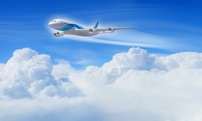 White passenger plane flying in the blue sky with white clouds around