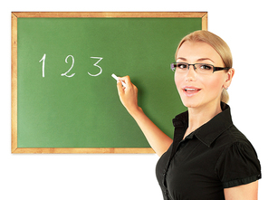 Young teacher writing numbers on the chalkboard, isolated on white background, conceptual image of education