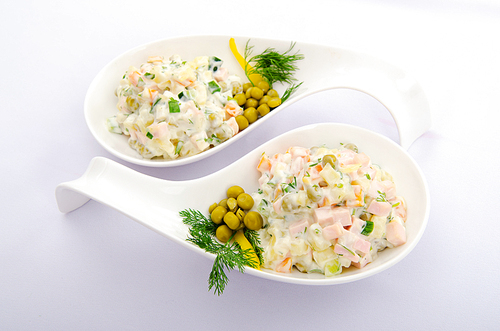 Riussian salad served in the plate