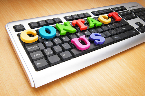 Contact us concept with letters on keyboard