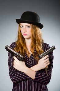 Woman gangster with gun in vintage concept