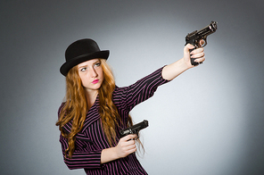 Woman gangster with gun in vintage concept