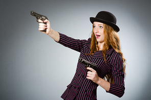 Woman gangster with gun in vintage concept