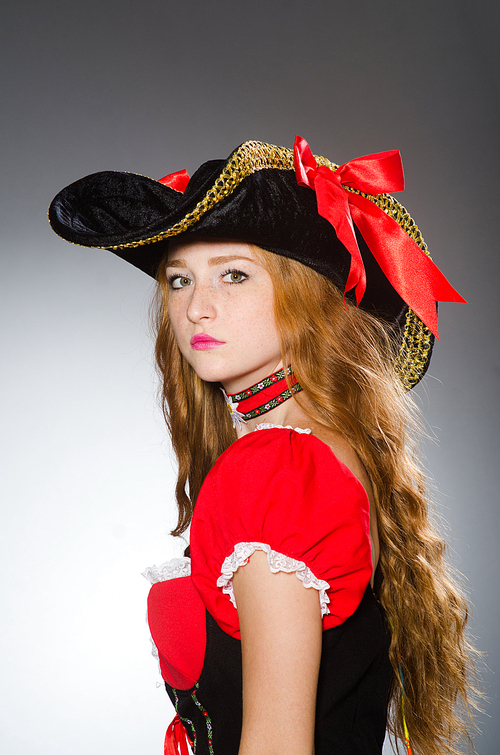 Woman pirate wearing hat and costume