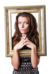 Young woman with picture frame on white