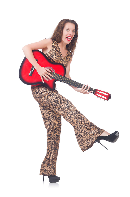 Woman in leopard clothing on white with guitar