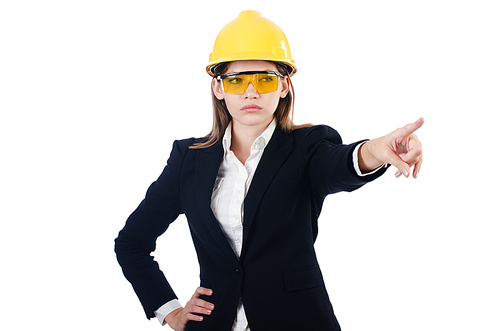 Pretty businesswoman with hard hat pressing  virtual buttons  isolated on white