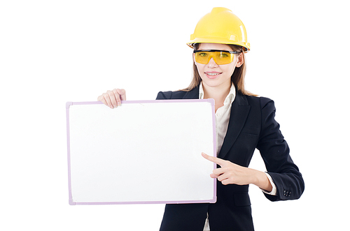 Pretty businesswoman with hard hat and blank board   isolated on white