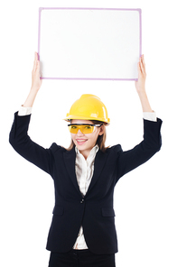 Pretty businesswoman with hard hat and blank board   isolated on white