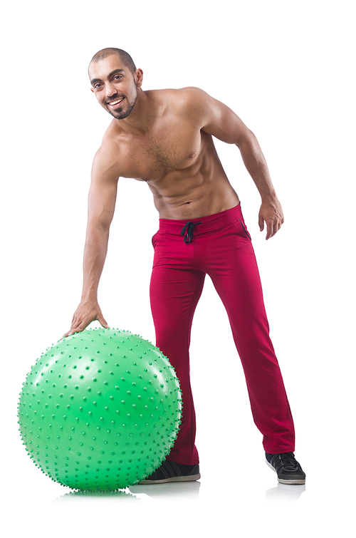 man with  ball doing exercises on white