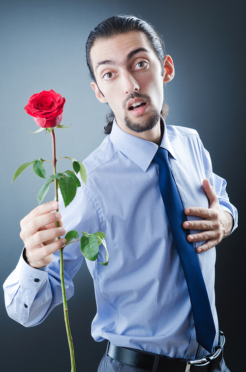 Young man with red rose