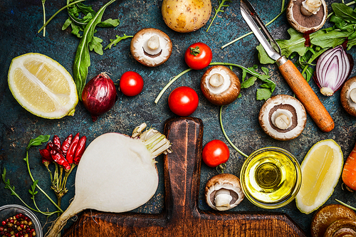 Vegetables and ingredients for  health cooking on rustic background, top view. Vegetarian and diet concept.