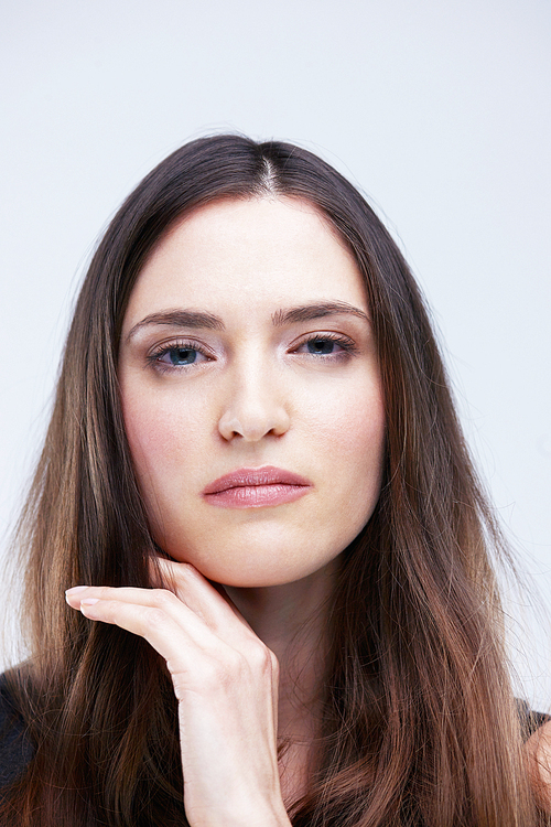 portrait of young woman isolated on white  in studio