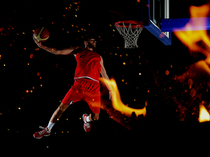 double exposure of  fire and  basketball  player,  sport player in action isolated on black background