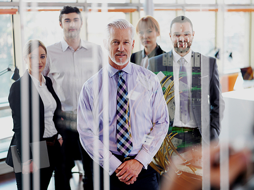 Double exposure design. Senior businessman with his team at office. business people group