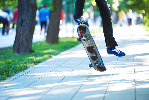 urban scene, closeup of skateboard jump