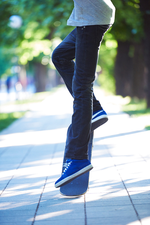 urban scene, closeup of skateboard jump