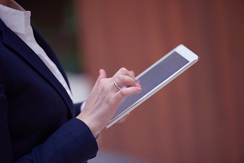 corporate business woman working on tablet computer  at modern office interior