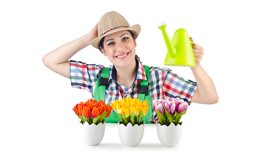 Girl watering plants on white