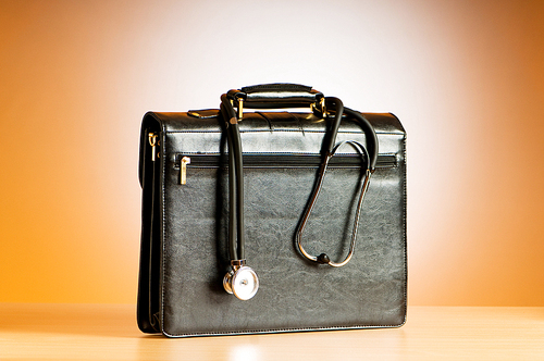 Doctor's case with stethoscope against colorful background