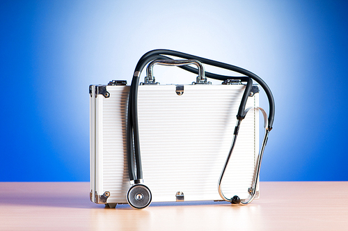 Doctor's case with stethoscope against colorful background