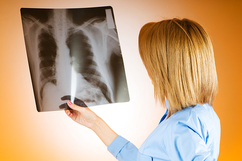 Female doctor carefully x-ray of patient