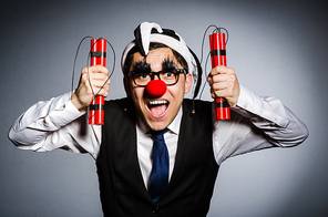 Funny clown with sticks of dynamite