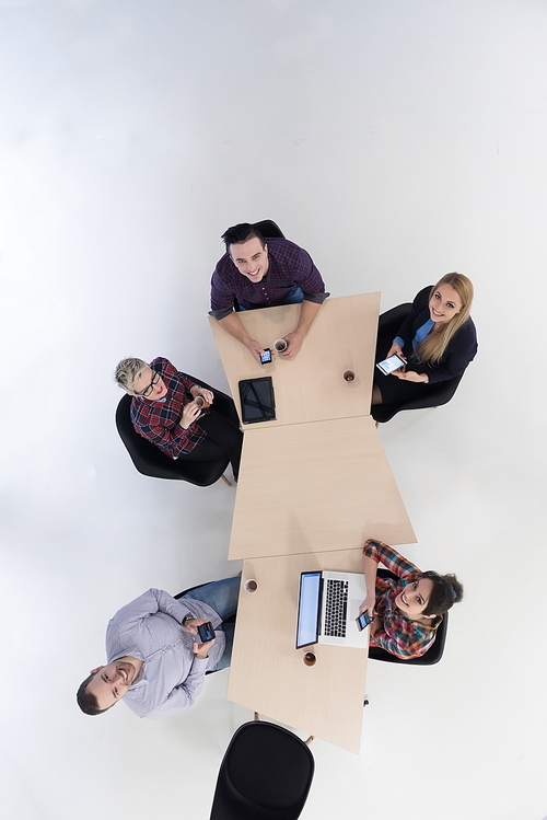 top view of multi ethnic startup business people group on brainstorming meeting in modern bright office interior