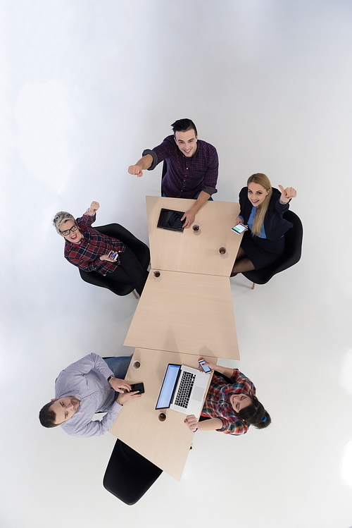 top view of multi ethnic startup business people group on brainstorming meeting in modern bright office interior