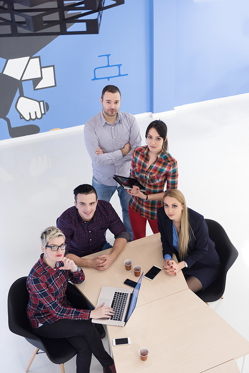 top view of multi ethnic startup business people group on brainstorming meeting in modern bright office interior