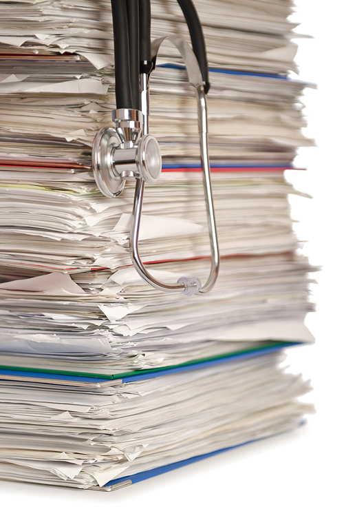 Stack of papers with stethoscope