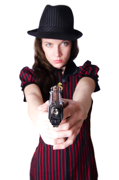 Woman gangster with handgun on white