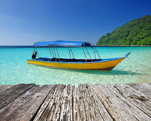 Beautiful beach with motor boat at Perhentian islands, Malaysia