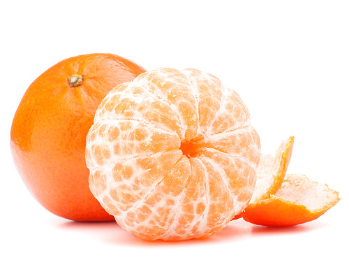 Peeled tangerine or mandarin fruit isolated on white cutout