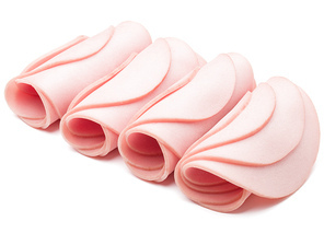 cooked boiled ham sausage or rolled bologna slices isolated on white cutout