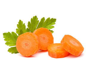 Chopped carrot slices and parsley herb leaves still life isolated on white cutout